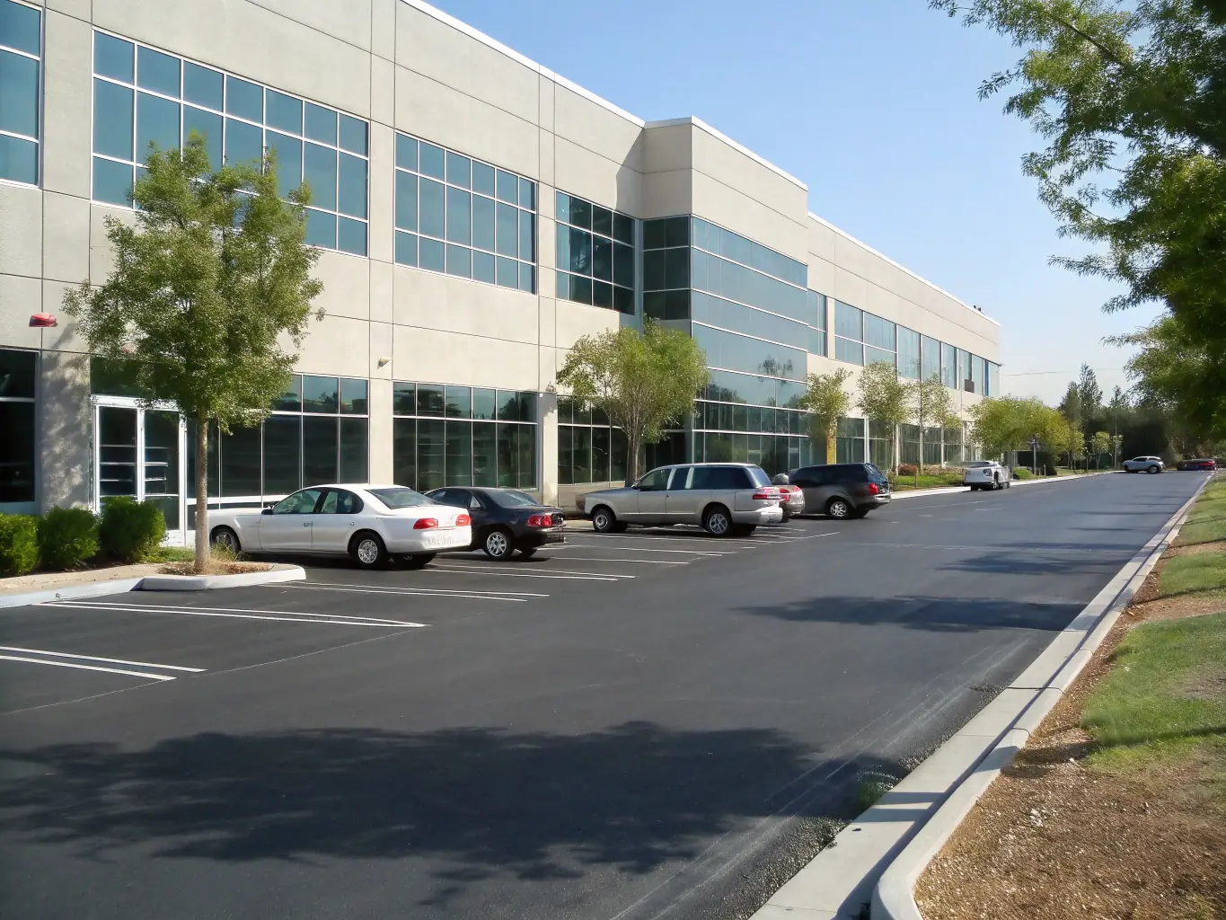 A commercial building with a spotless exterior and clean parking lot, demonstrating the professional cleaning results achieved by Pressure Washing Folsom's commercial pressure washing services.